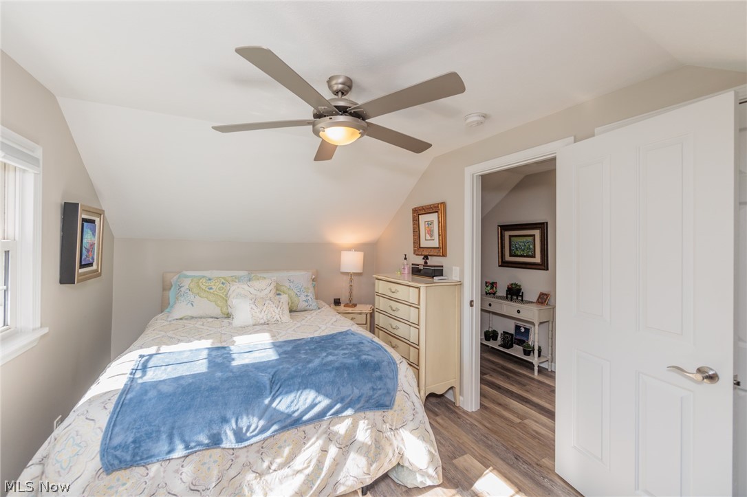 120 Sunset Road Avon Lake, OH 44012 - Photo 21 of 40 Bedroom featuring ceiling fan, wood-type flooring, and vaulted ceiling