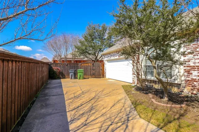 a very nice looking yard with a large tree