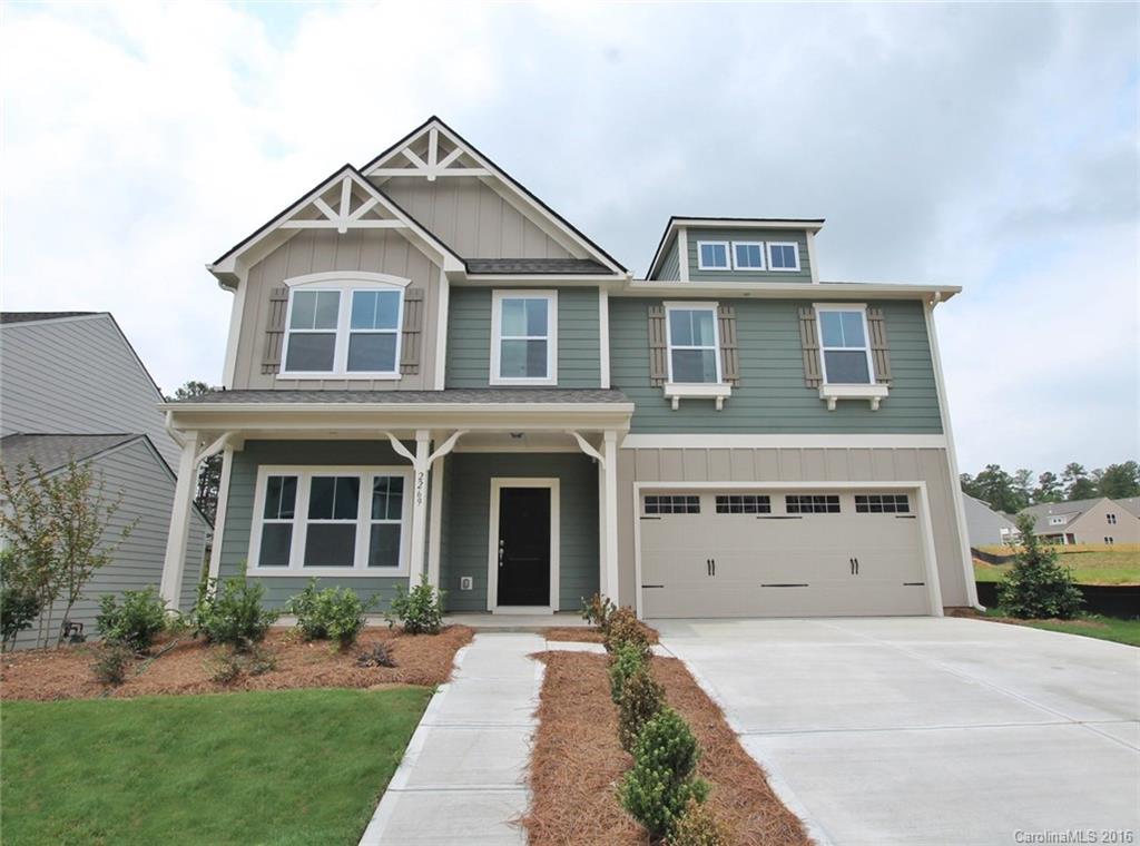 2269 Bluebell Way, Unit 26 Fort Mill, SC 29708 - Photo 1 of 21 a front view of a house with a yard and garage