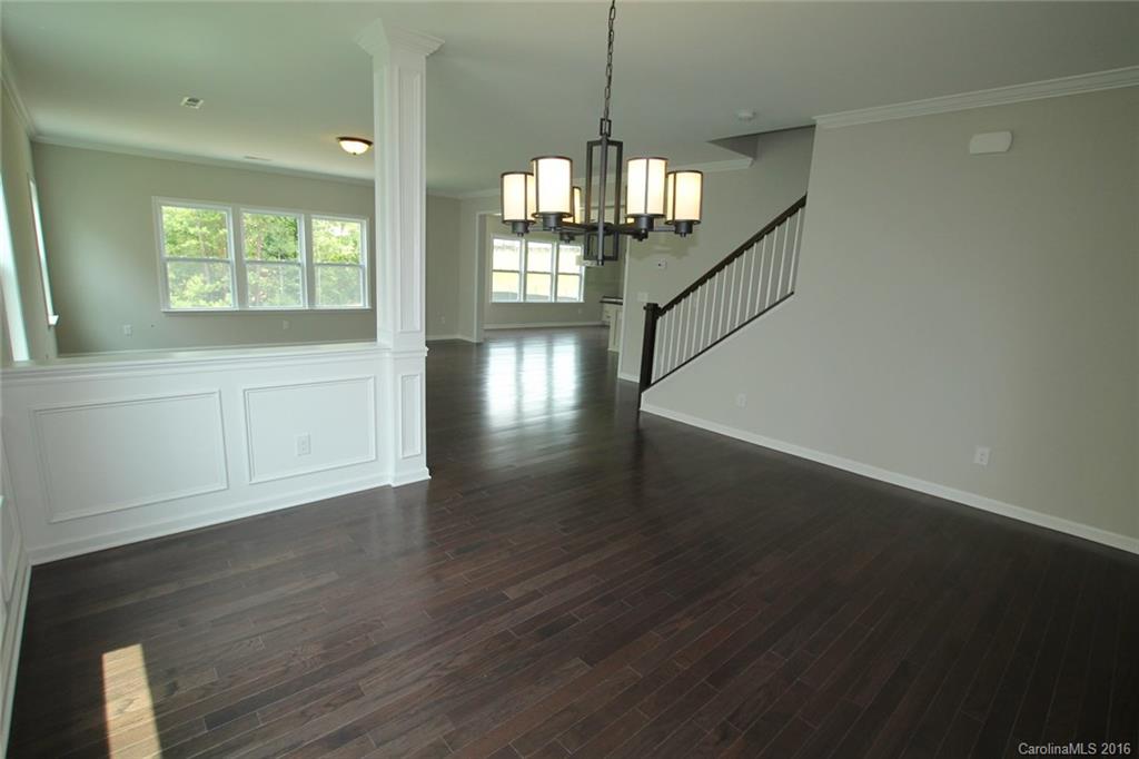 2269 Bluebell Way, Unit 26 Fort Mill, SC 29708 - Photo 4 of 21 a view of empty room with wooden floor and fan