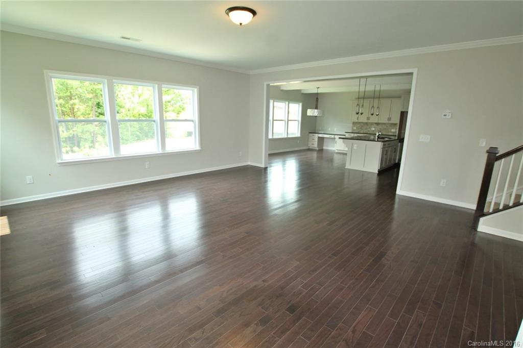 2269 Bluebell Way, Unit 26 Fort Mill, SC 29708 - Photo 6 of 21 an empty room with wooden floor and windows