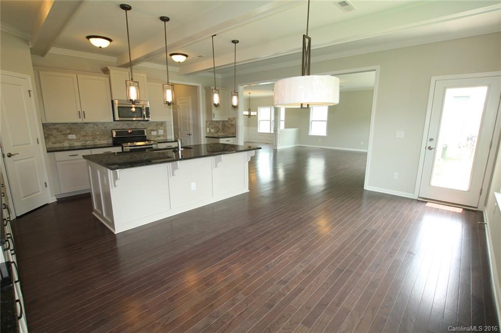 2269 Bluebell Way, Unit 26 Fort Mill, SC 29708 - Photo 10 of 21 a kitchen with stainless steel appliances granite countertop wooden floors sink and cabinets