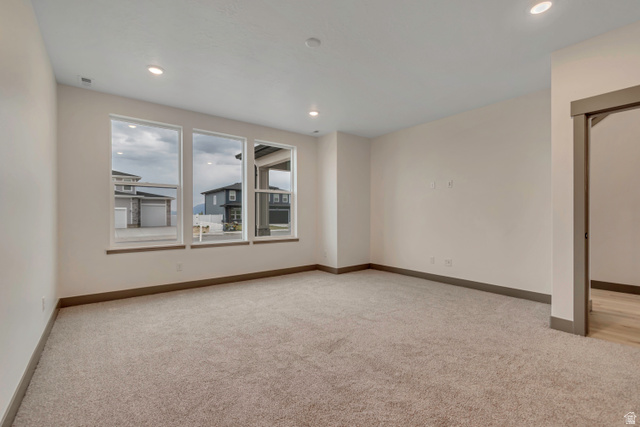 3317 South 1000 West, Unit 6010 Logan, UT 84321 - Photo 6 of 34 Spare room featuring light carpet and recessed lighting