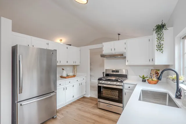 a view of balcony with wooden floor and fence