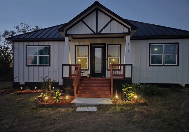 a front view of a house with yard
