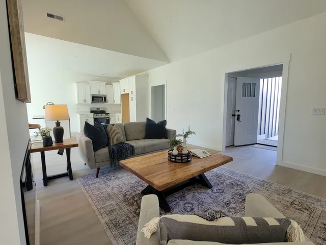 a living room with furniture and a rug