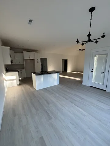 a view of a livingroom with wooden floor