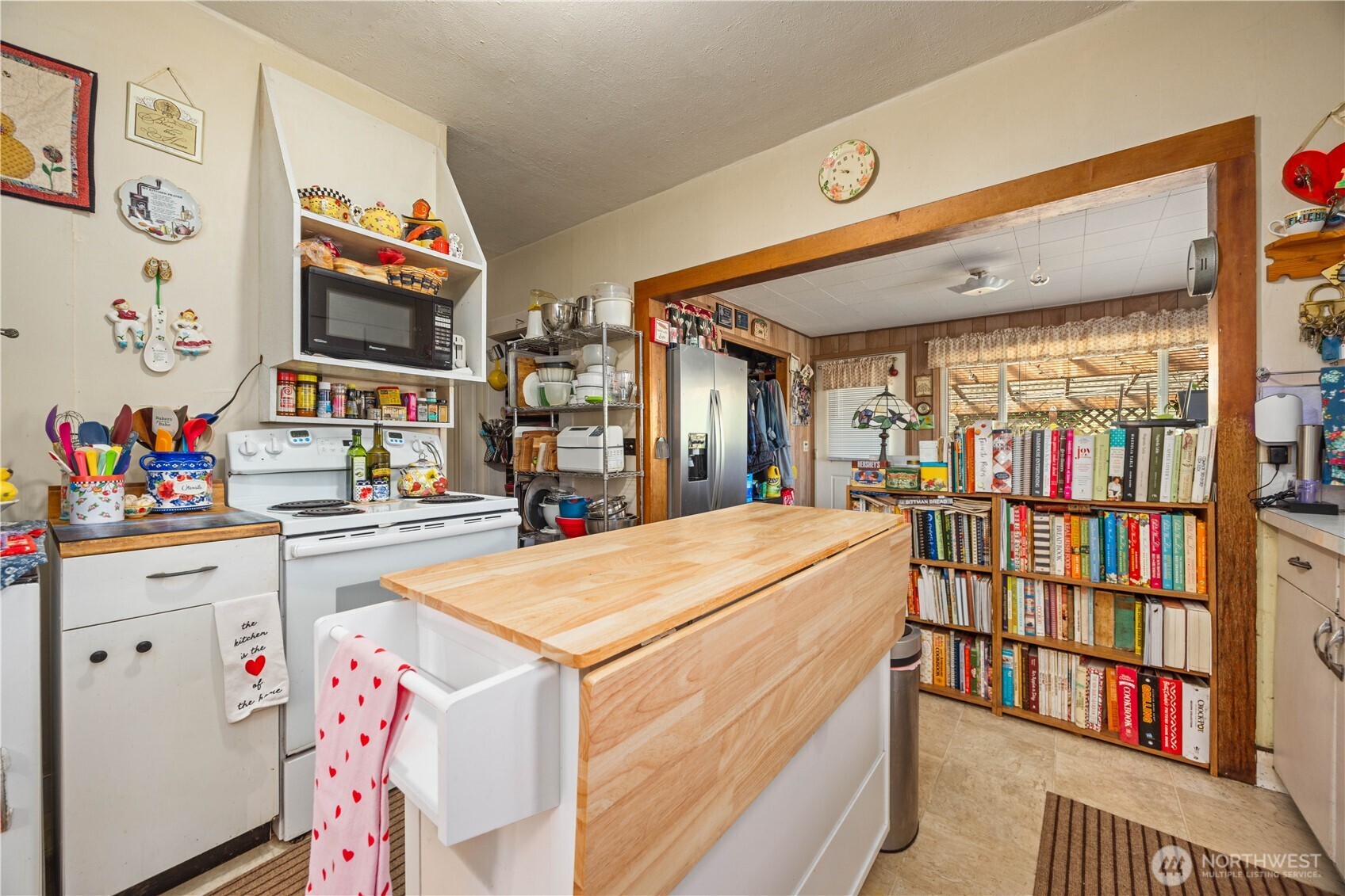 1281 Totem Pole Road Manson, WA 98831 - Photo 18 of 39 a utility room with dryer and book shelf