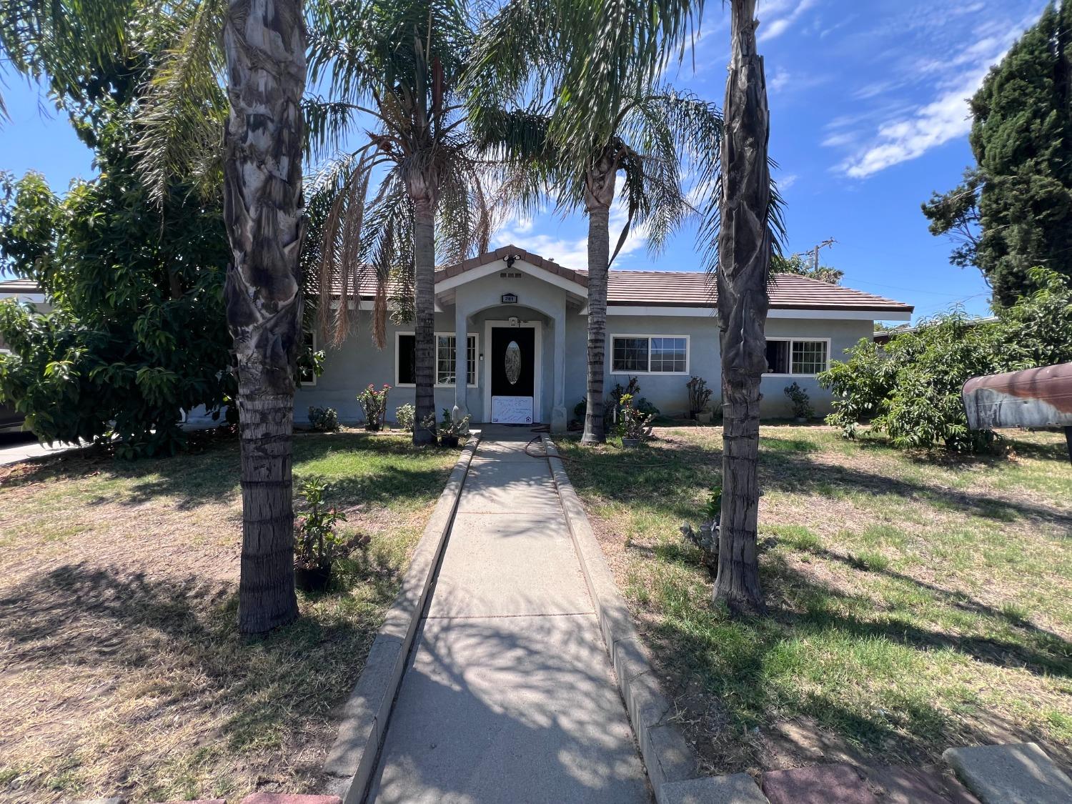 281 West Wilson Street Rialto, CA 92376 - Photo 1 of 15 a front view of house with yard and green space