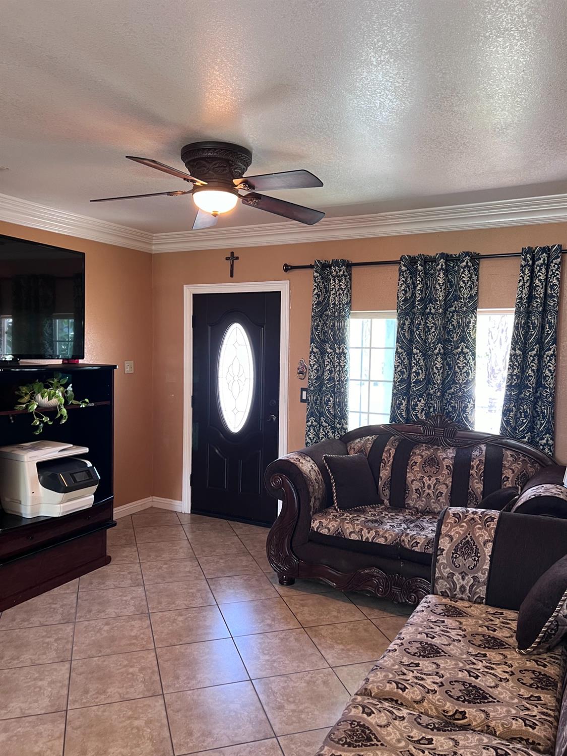 281 West Wilson Street Rialto, CA 92376 - Photo 3 of 15 a living room with furniture and a flat screen tv