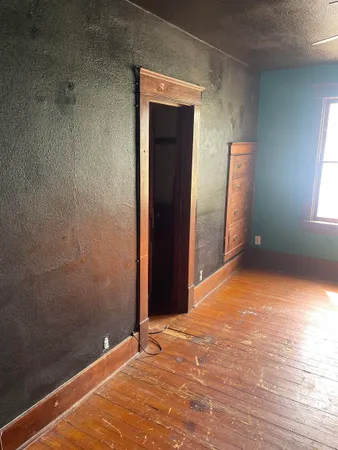 a view of fireplace and cabinets