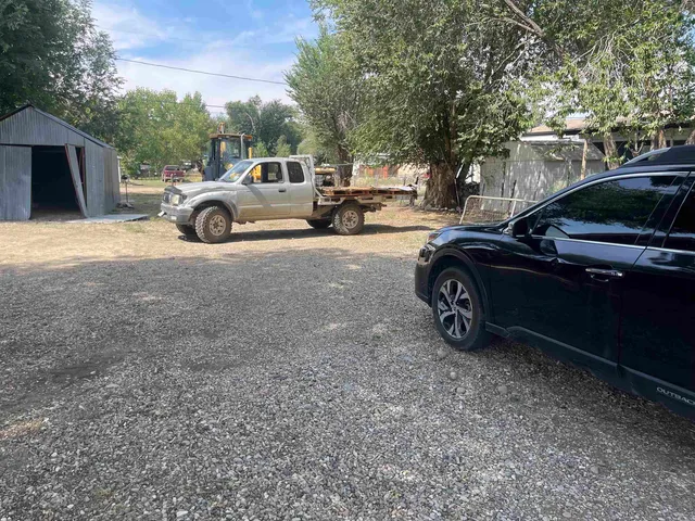 a view of a car parked in front of a house