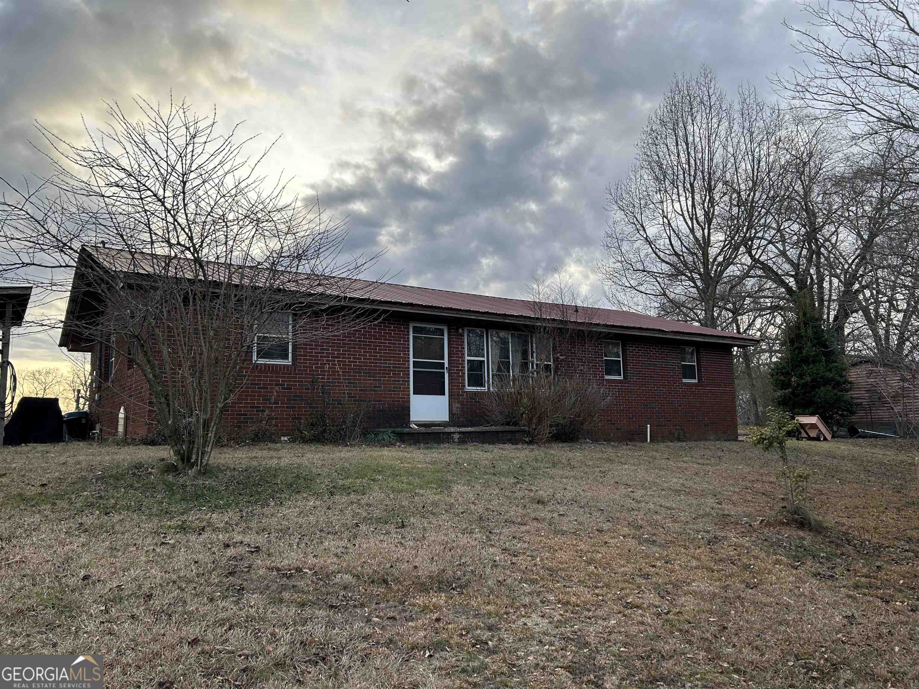 4891 Duncan Bridge Road Southwest Cornelia, GA 30531 - Photo 1 of 1 a house view with a backyard space