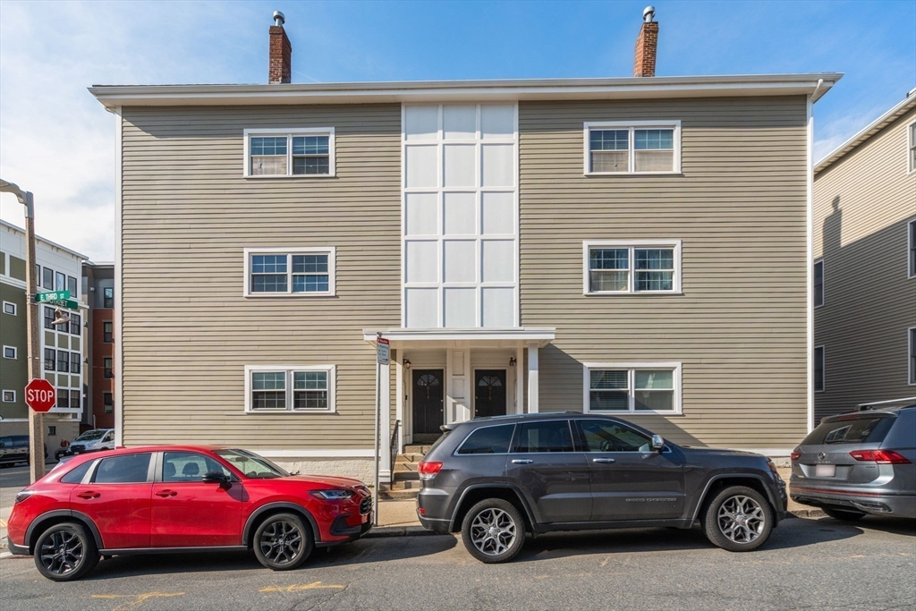 614 East 3rd Street, Unit 1 Boston, MA 02127 - Photo 20 of 23 a car parked in front of a house