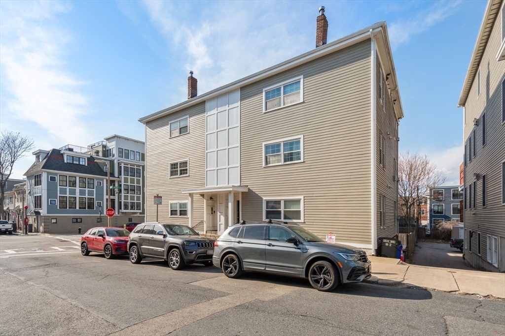 614 East 3rd Street, Unit 1 Boston, MA 02127 - Photo 21 of 23 a car parked in front of a house