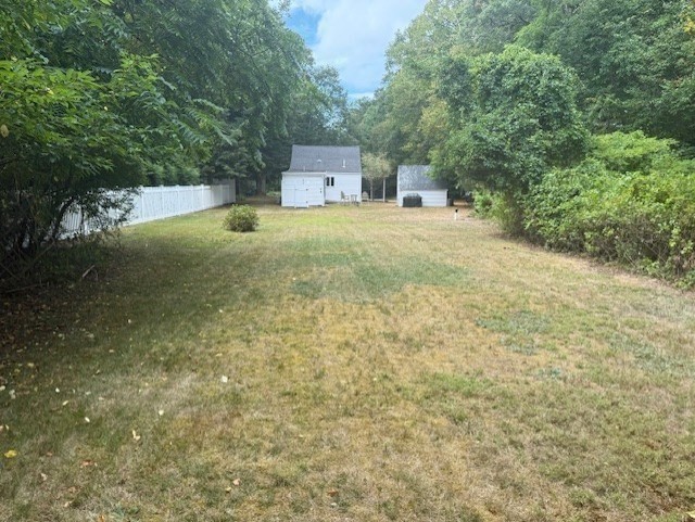 428 Main Street Barnstable, MA 02635 - Photo 13 of 27 a backyard of a house with yard and outdoor seating
