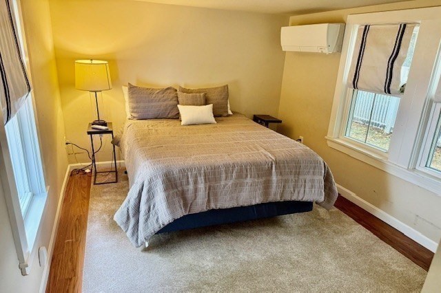 428 Main Street Barnstable, MA 02635 - Photo 15 of 27 a bedroom with a bed and walk in closet
