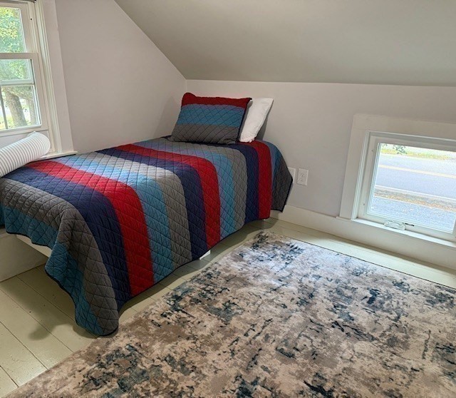 428 Main Street Barnstable, MA 02635 - Photo 16 of 27 a bed sitting in a bedroom next to a window