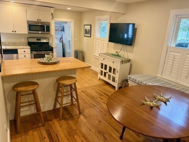 428 Main Street Barnstable, MA 02635 - Photo 6 of 27 a living room with furniture and a flat screen tv