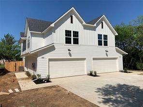 a front view of a house with a garage