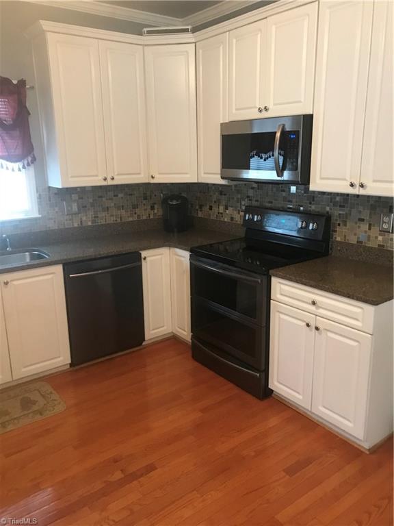 Quartz countertops, full tile backsplash and newer appliances!