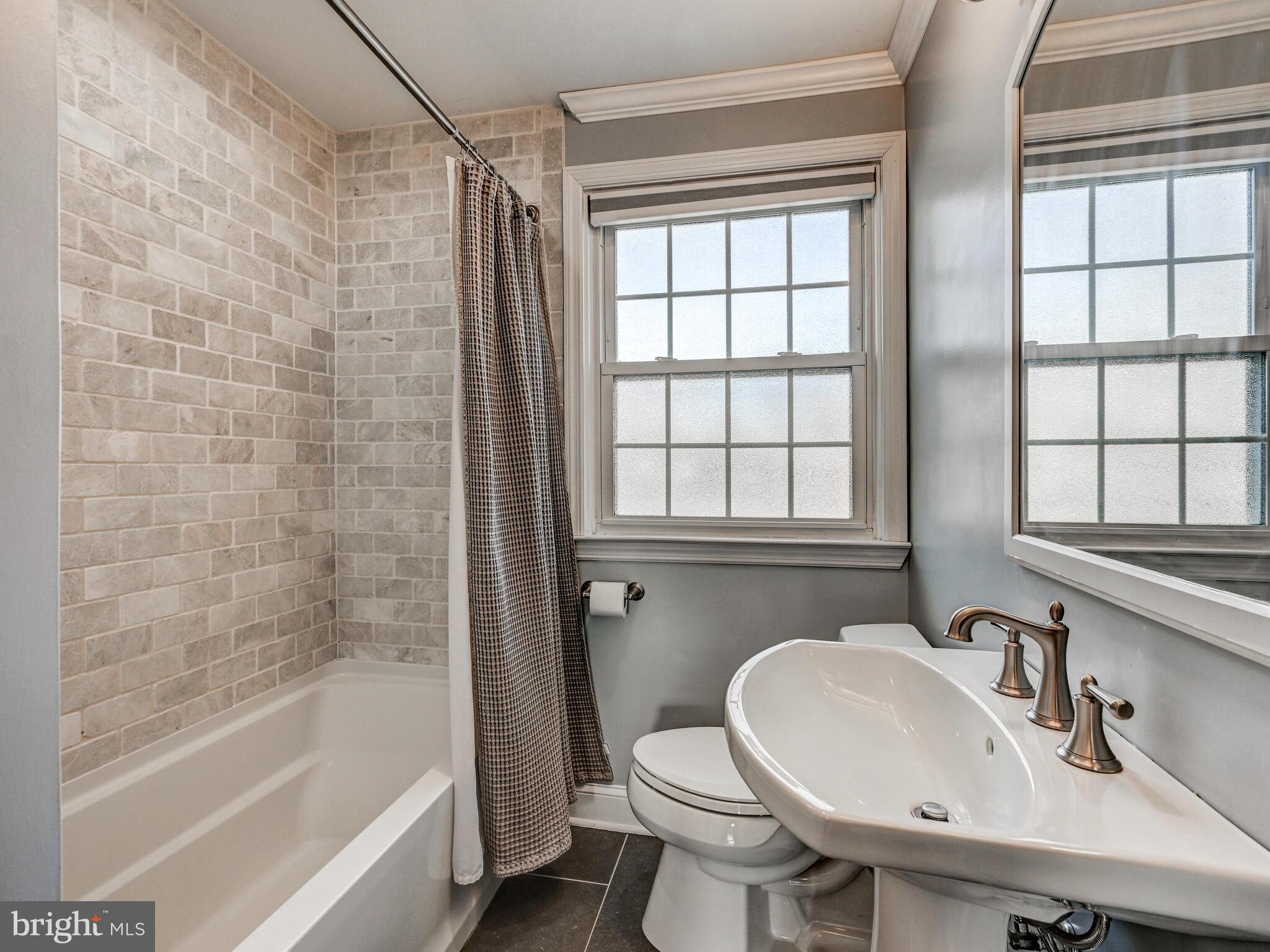 1507 Clearwood Road Parkville, MD 21234 - Photo 21 of 27 a bathroom with a sink bathtub and a toilet