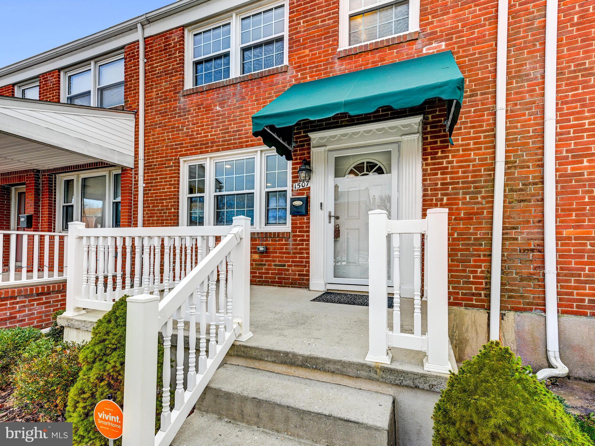 1507 Clearwood Road Parkville, MD 21234 - Photo 3 of 27 a view of a brick house with a small yard