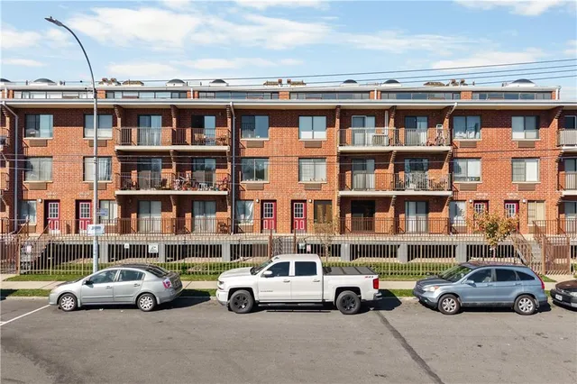 an aerial view of residential building and ocean