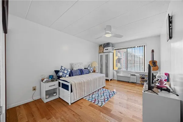 a bedroom with furniture and a window