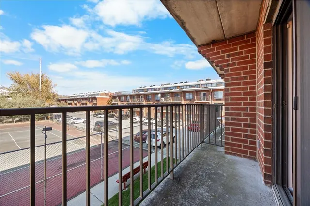 a kitchen with stainless steel appliances granite countertop a sink a refrigerator and a wooden cabinets