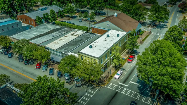 an aerial view of a house with an outdoor space