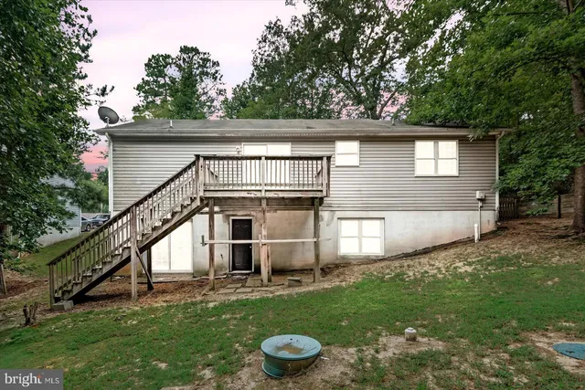 a view of a field of grass and trees