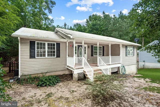 a house with trees in the background