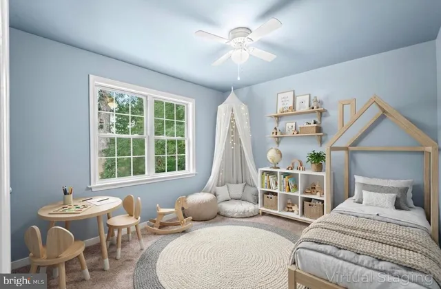 a bedroom with furniture and a large window