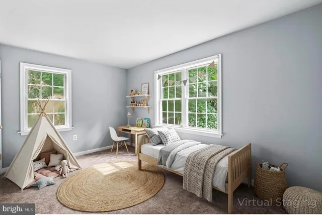 a bed room with a bed and a chair