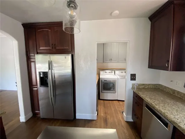 a kitchen with a refrigerator sink and stove