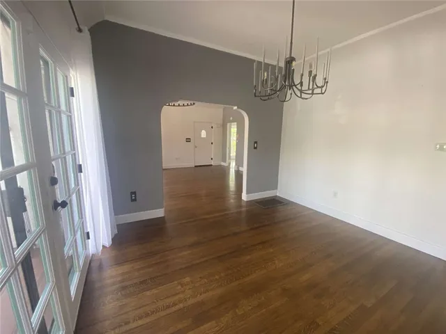 a view of a room with wooden floor and staircase