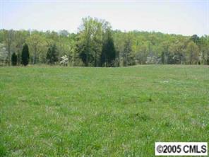 13985 Old Camden Road Midland, NC 28107 - Photo 5 of 8 a view of a field with trees in the background