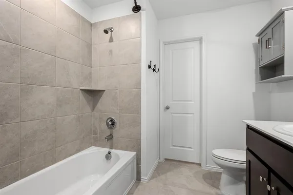 a bathroom with a bathtub toilet and sink