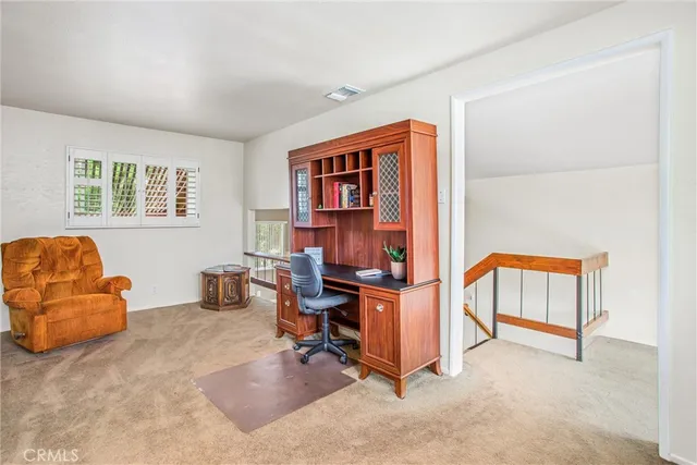 a workspace with furniture and window