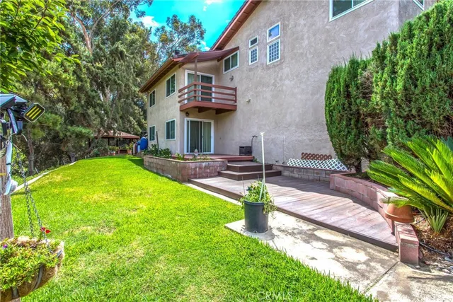 a view of a yard with large trees