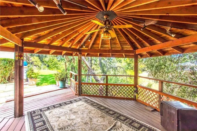 a view of a house with a yard and potted plants