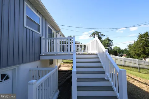 a view of balcony with furniture