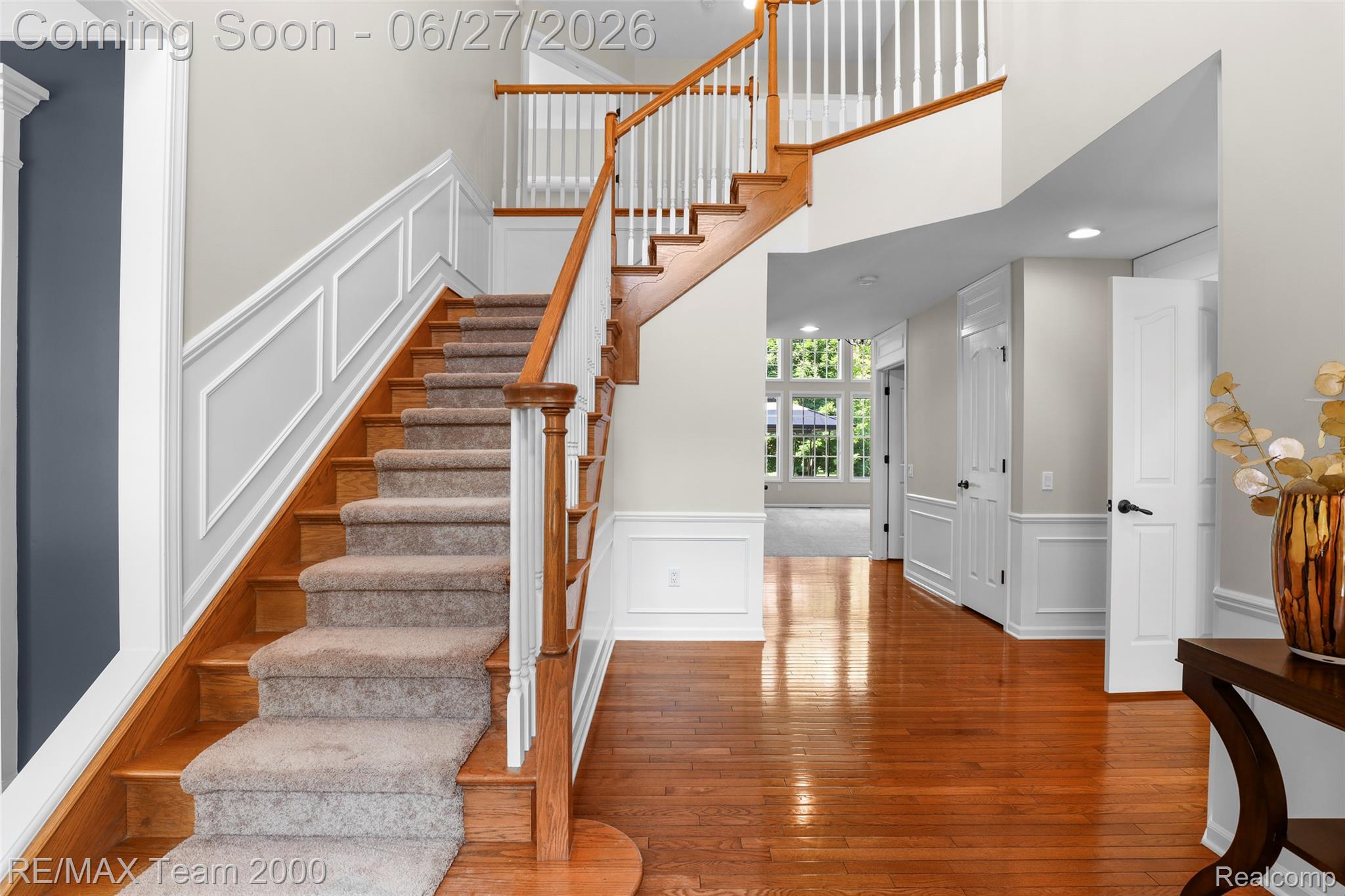 1248 Lasalle Road Canton, MI 48187 - Photo 18 of 67 Grand foyer featuring hardwood flooring, a prominent staircase with wood treads and white balusters, wainscoting details, and recessed lighting