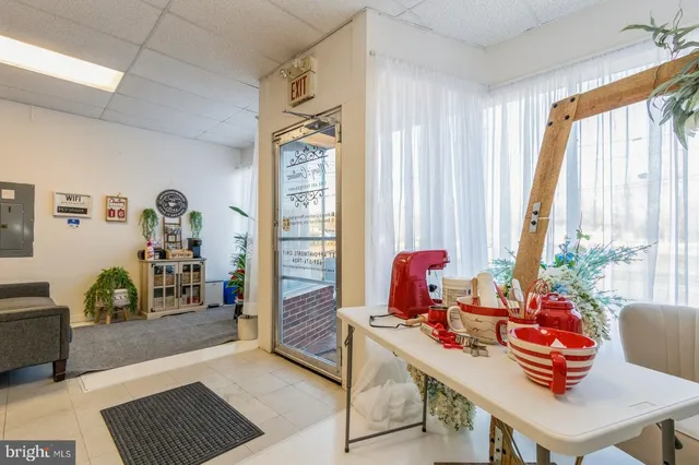 a bathroom with a toilet and a shower curtain
