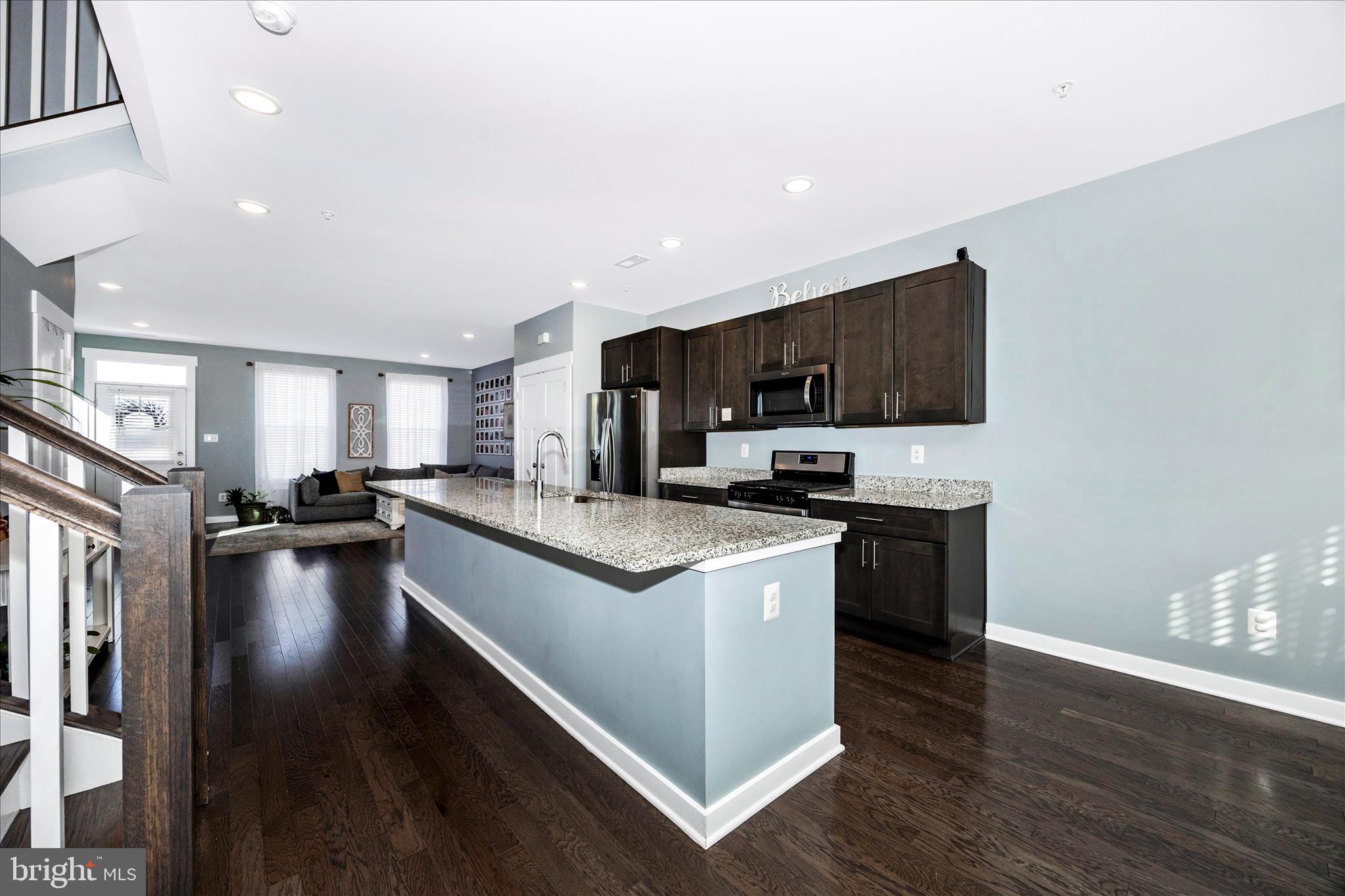 1314 Marsalis Place Frederick, MD 21702 - Photo 14 of 64 a kitchen with stainless steel appliances granite countertop a stove top oven a sink dishwasher and a refrigerator with wooden floor