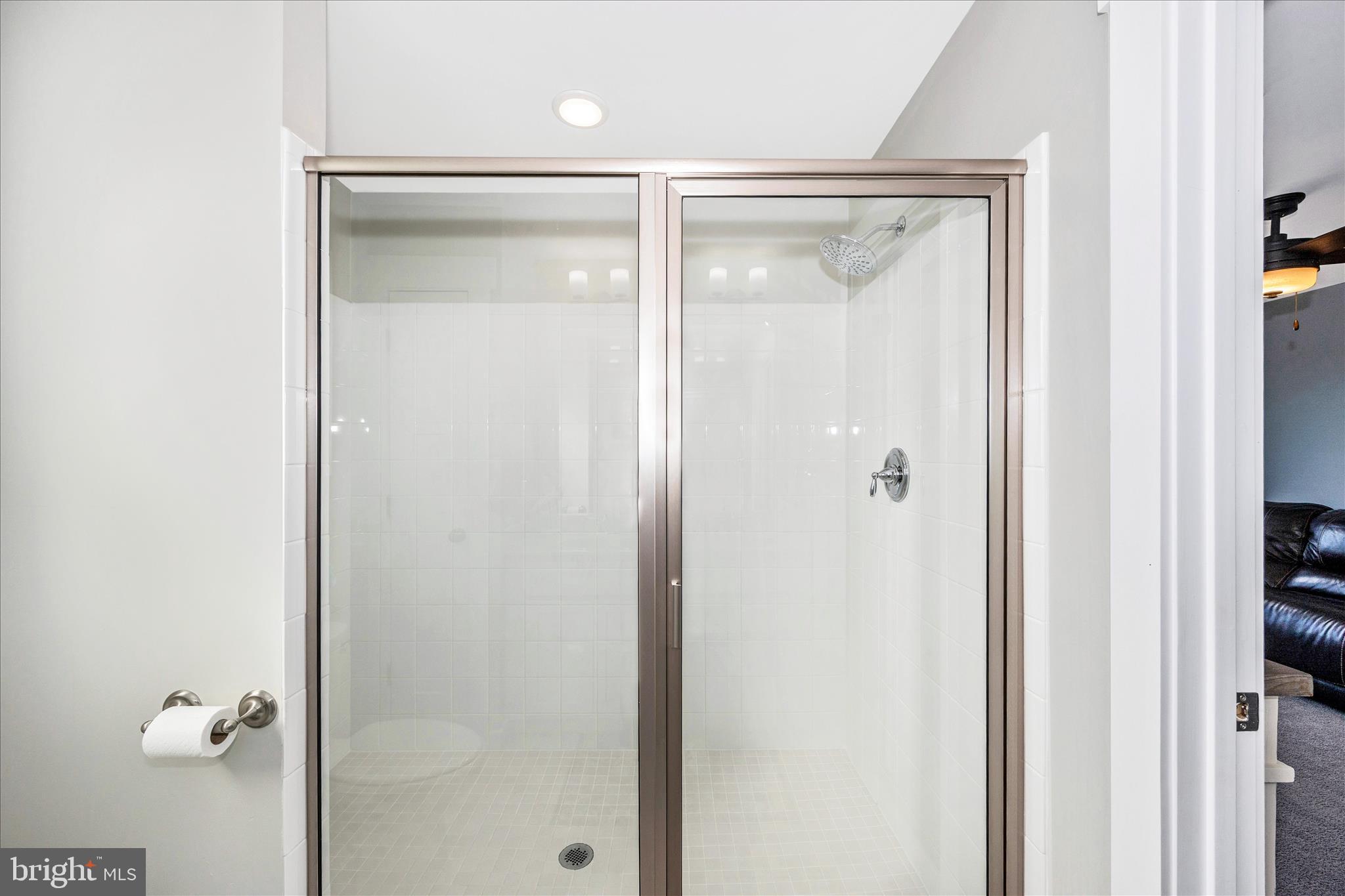 1314 Marsalis Place Frederick, MD 21702 - Photo 39 of 64 a bathroom with a glass shower door