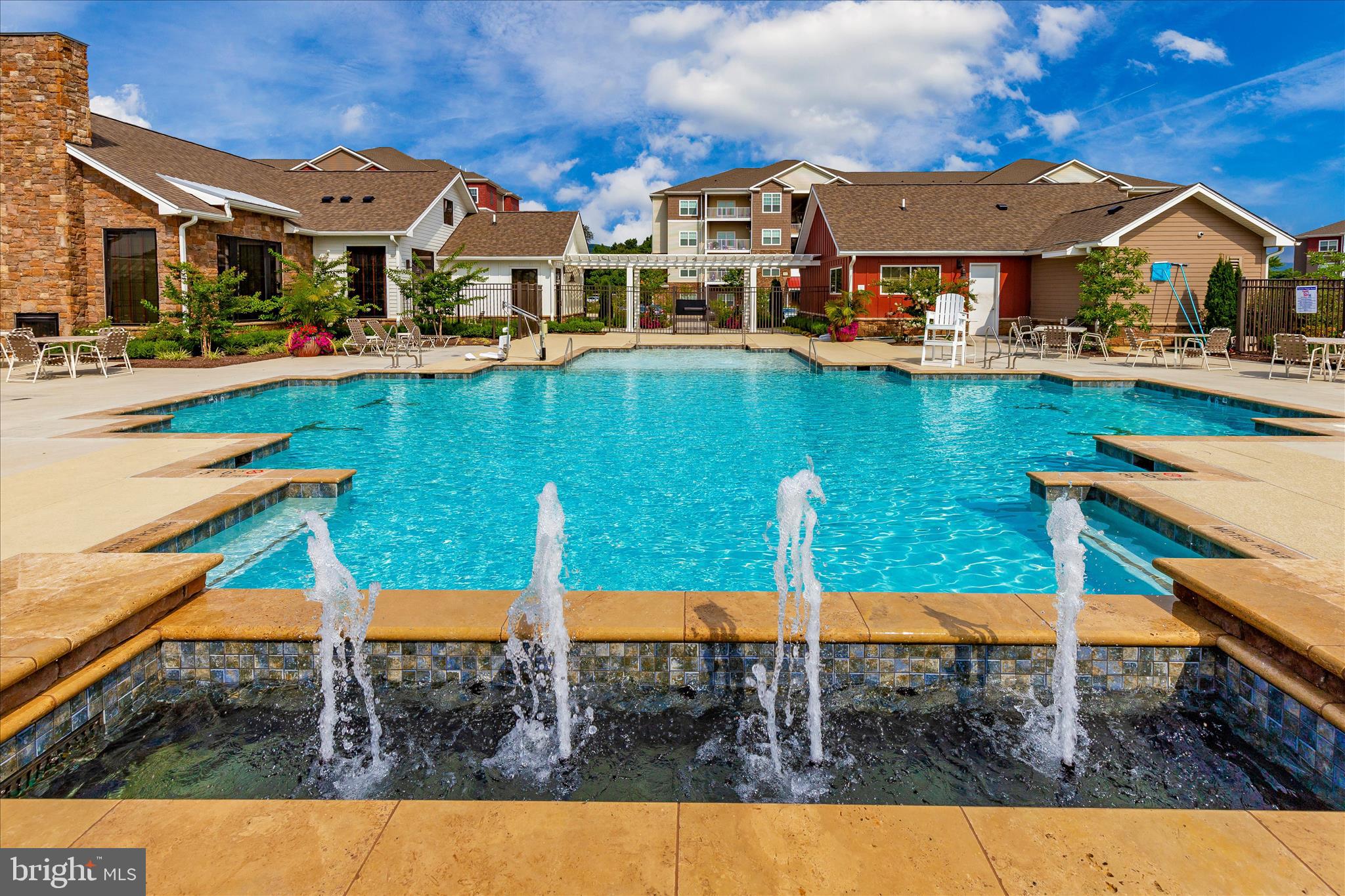 1314 Marsalis Place Frederick, MD 21702 - Photo 60 of 64 a view of a swimming pool with a chair and tables in the patio