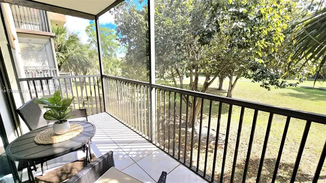 a view of balcony with furniture