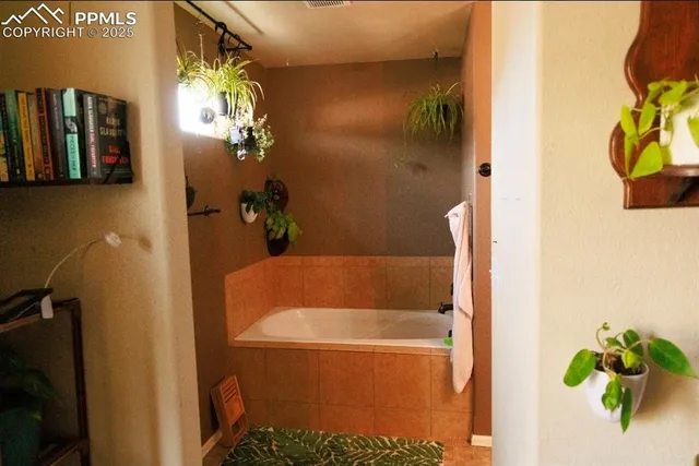 a bath tub sitting next to a window